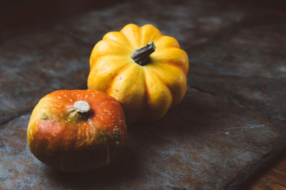 Free Image of Two Small Pumpkins on Table 