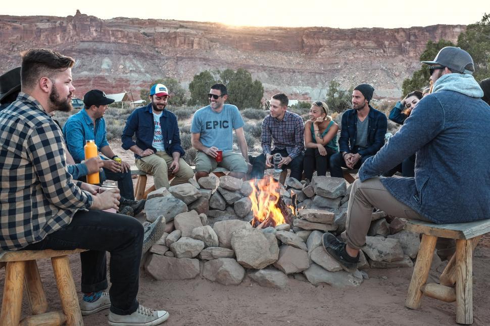 Free Image of Group of People Sitting Around Fire Pit 