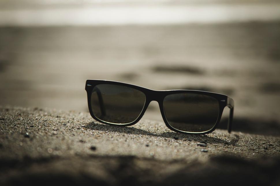 Free Image of Sunglasses Resting on Rock 