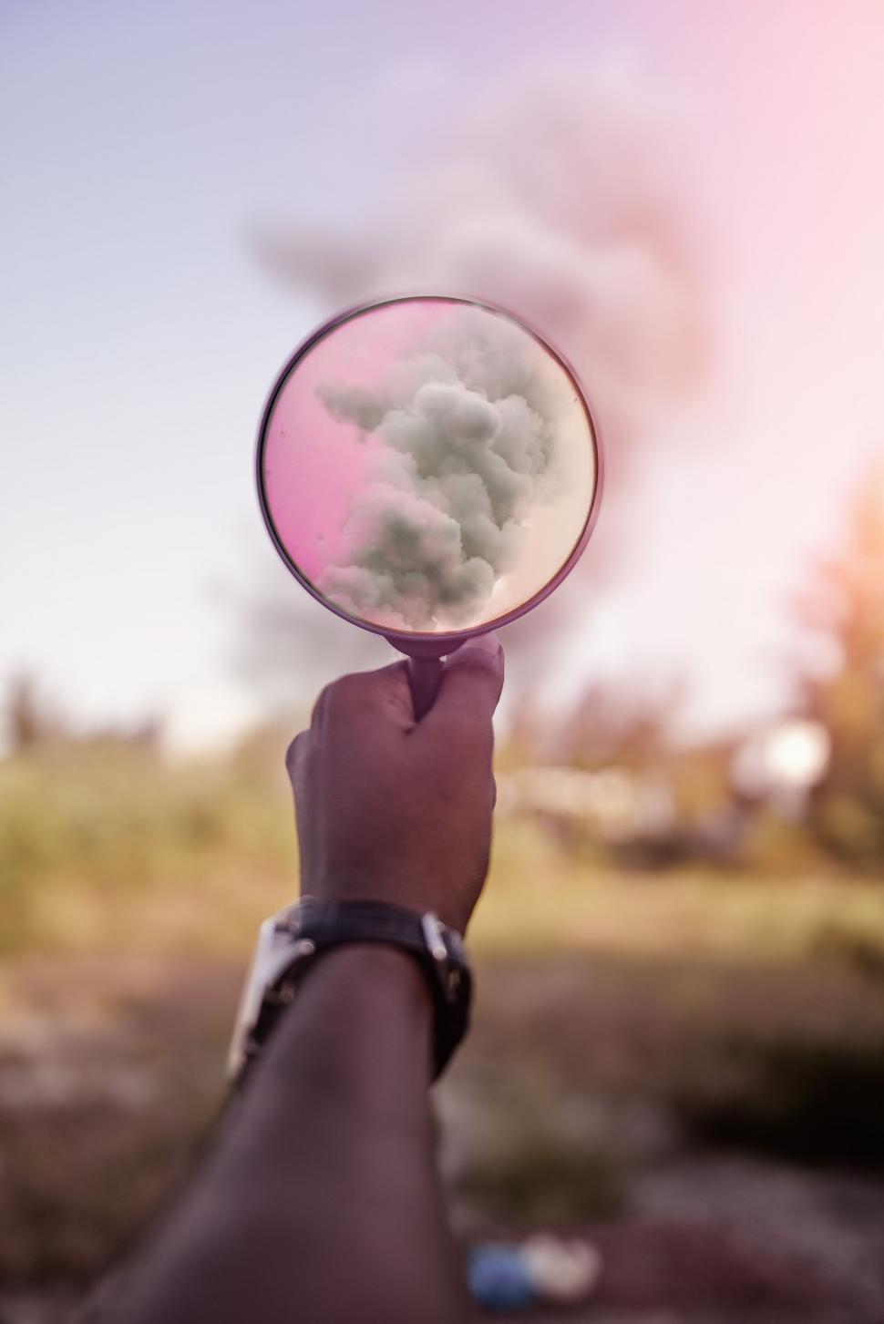 Free Image of Person Holding Mirror With Smoke 