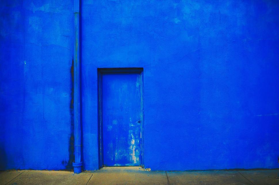 Free Image of Blue Wall With Open Door 