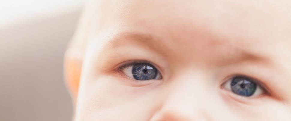Free Image of Close Up of a Babys Face With Blue Eyes 