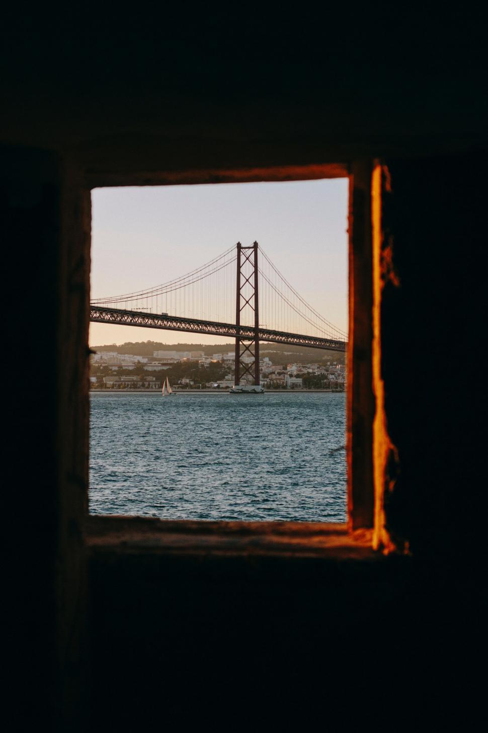 Free Image of The Bay Bridge Seen Through a Window 