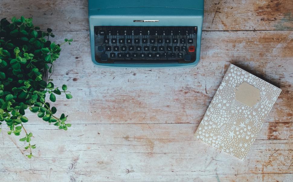 Free Image of Blue Typewriter on Wooden Table 