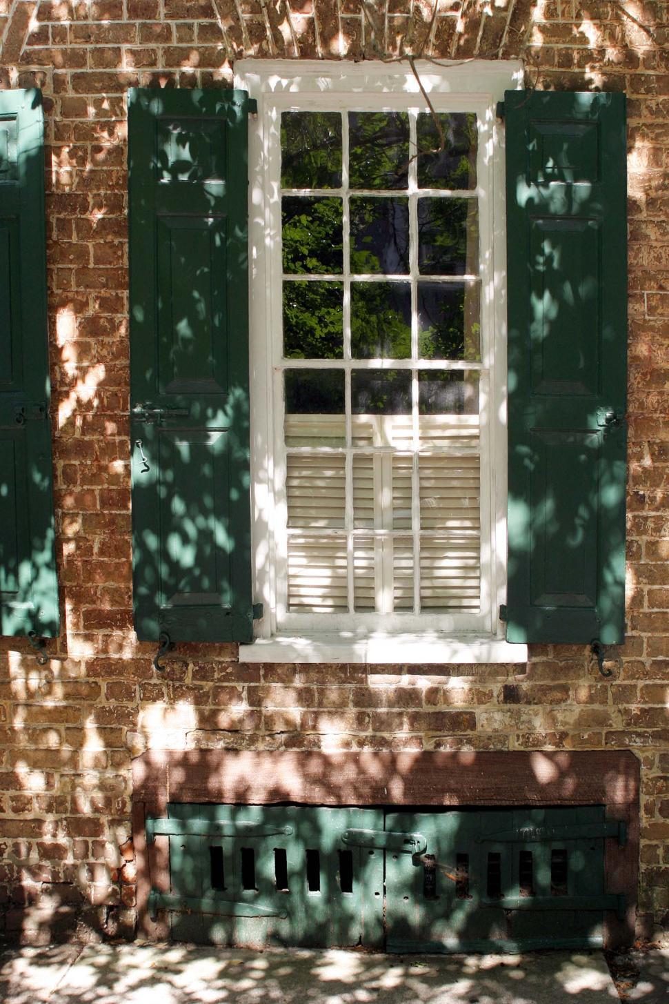 Free Image of window shutters brick wall charleston south carolina basement shadows exterior 