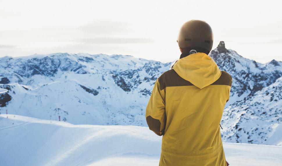 Free Image of Man Standing on Snow Covered Slope 