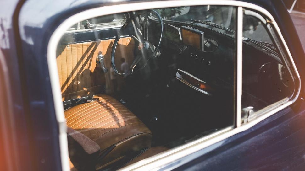 Free Image of Interior of an Old Car With the Door Open 