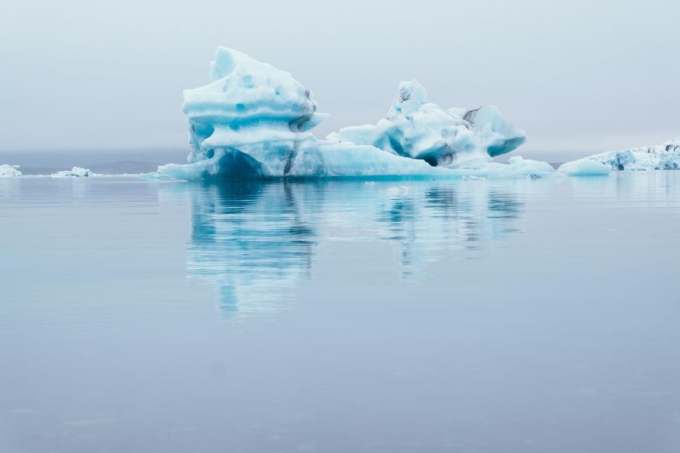 Free Image of Icebergs Drifting in Water on a Foggy Day 