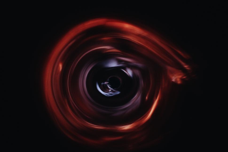 Free Image of Black and Red Swirl in the Dark 
