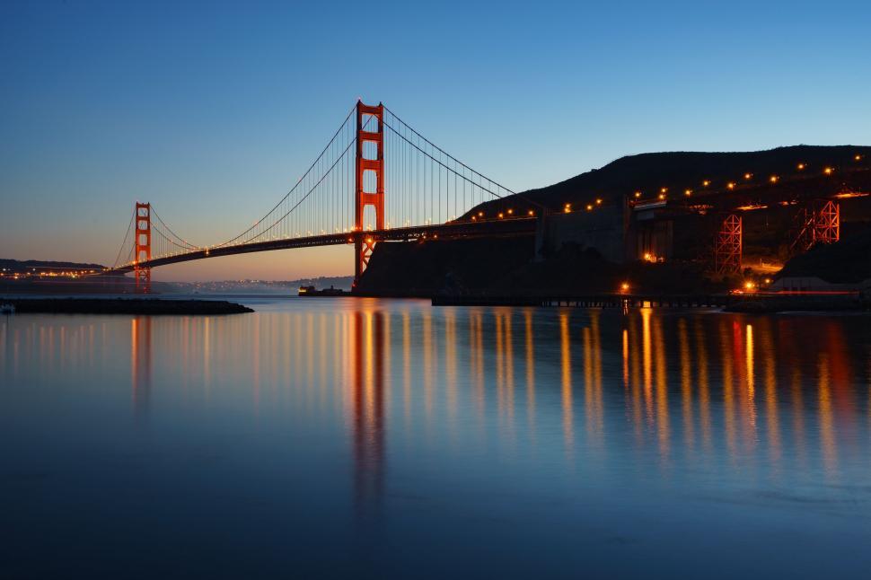 Free Image of The Golden Gate Bridge Glows Brightly at Night 