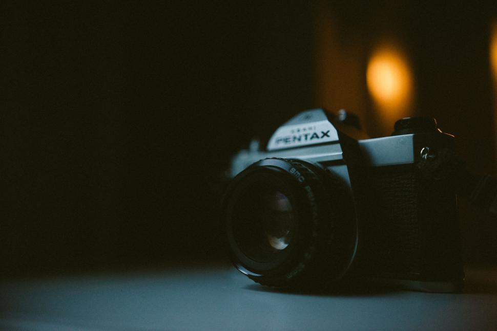 Free Image of Camera on Table in Dark 