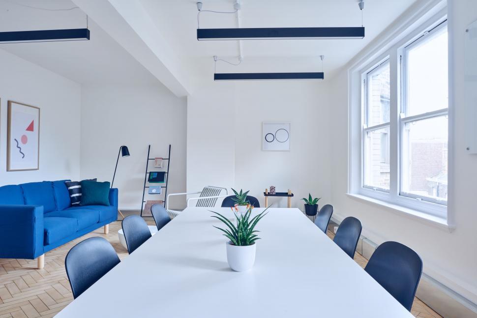 Free Image of White Table With Blue Chairs in Room 