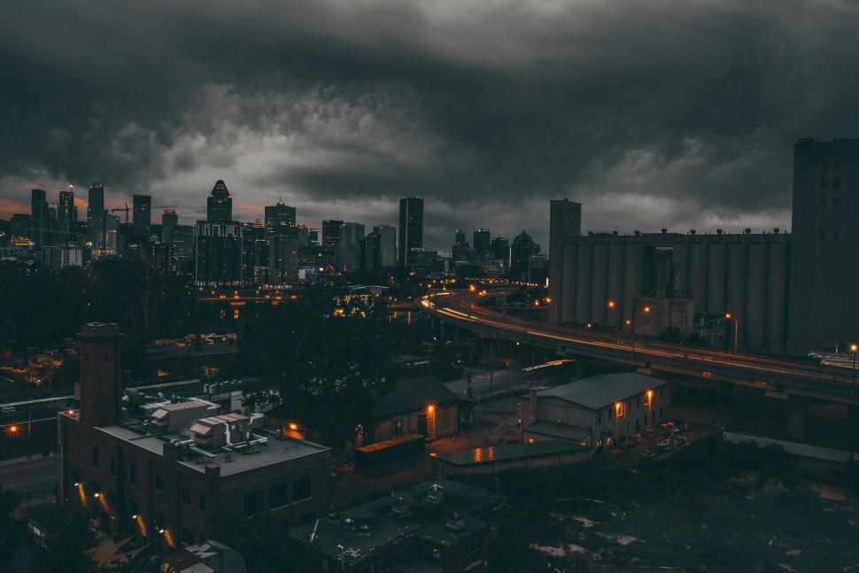 Free Image of City Skyline With Dark Clouds 