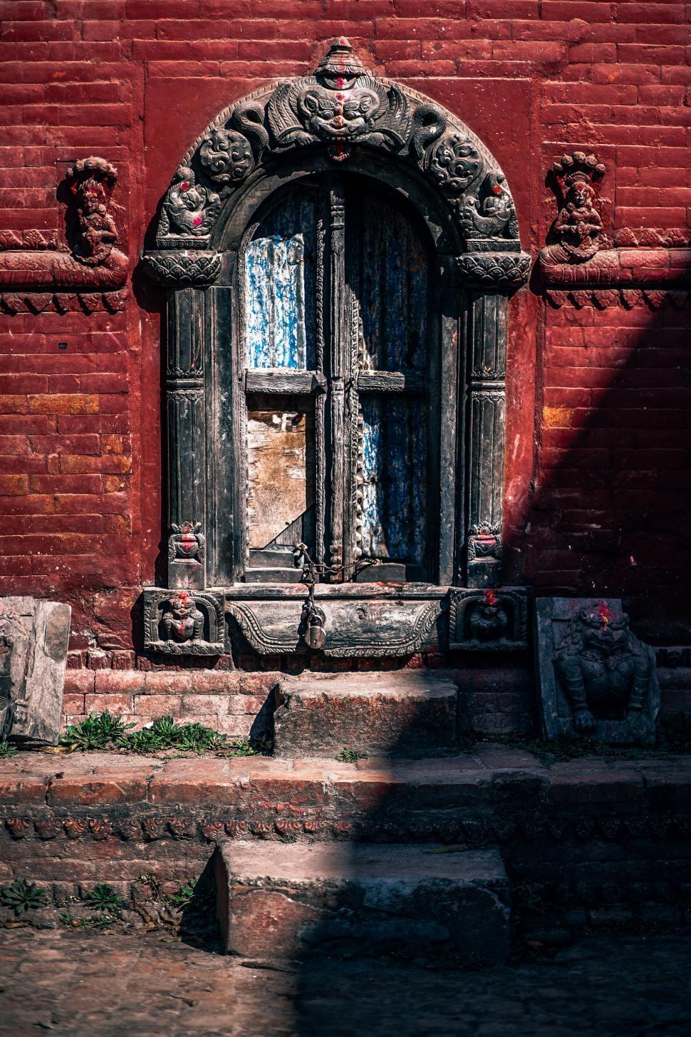 Free Image of Red Brick Building With Large Window 