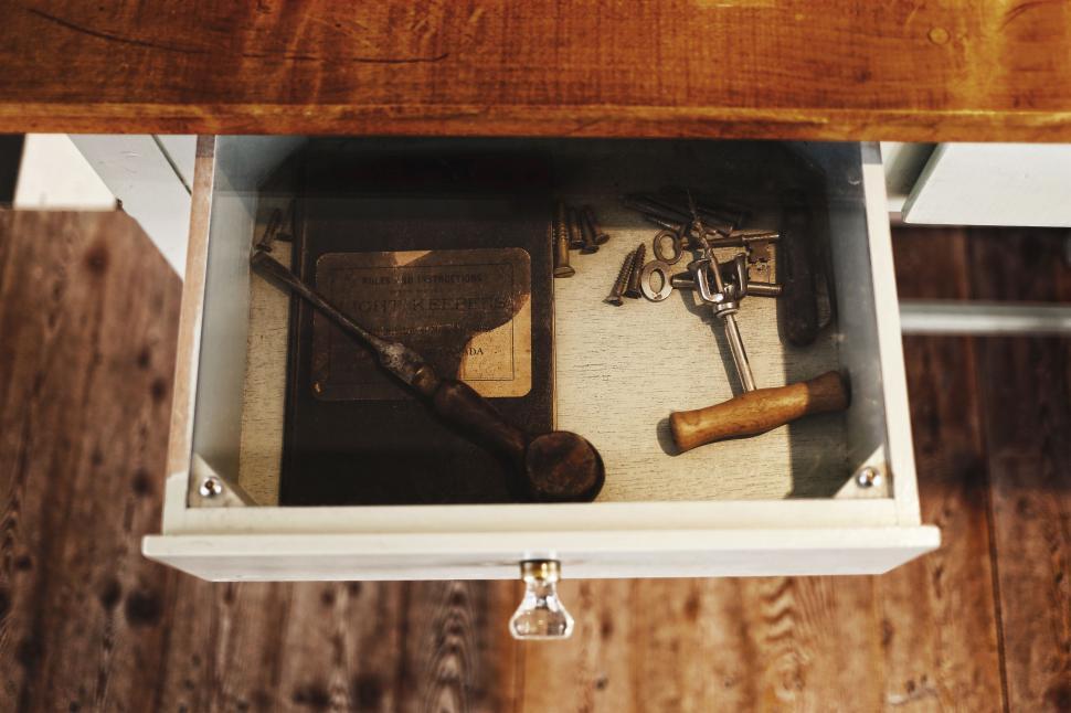 Free Image of A Drawer With Tools on Wooden Floor 