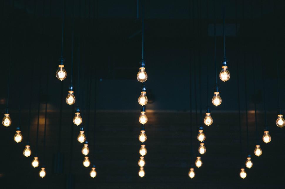 Free Image of Array of Light Bulbs Hanging From Ceiling 