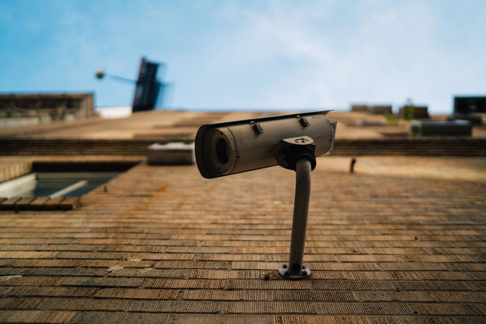 Free Image of Surveillance Camera Monitoring the Building Roof 