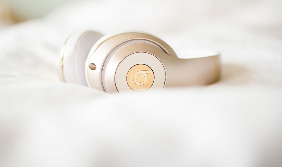 Free Image of Headphones Resting on Bed 
