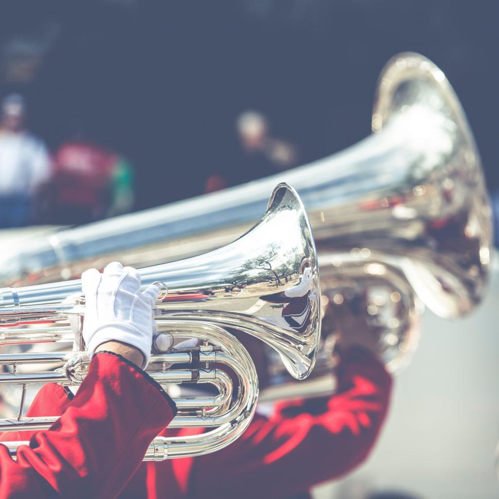 Free Image of Person Holding a Trumpet Up Close 