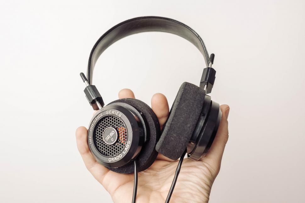 Free Image of Person Holding Pair of Headphones 