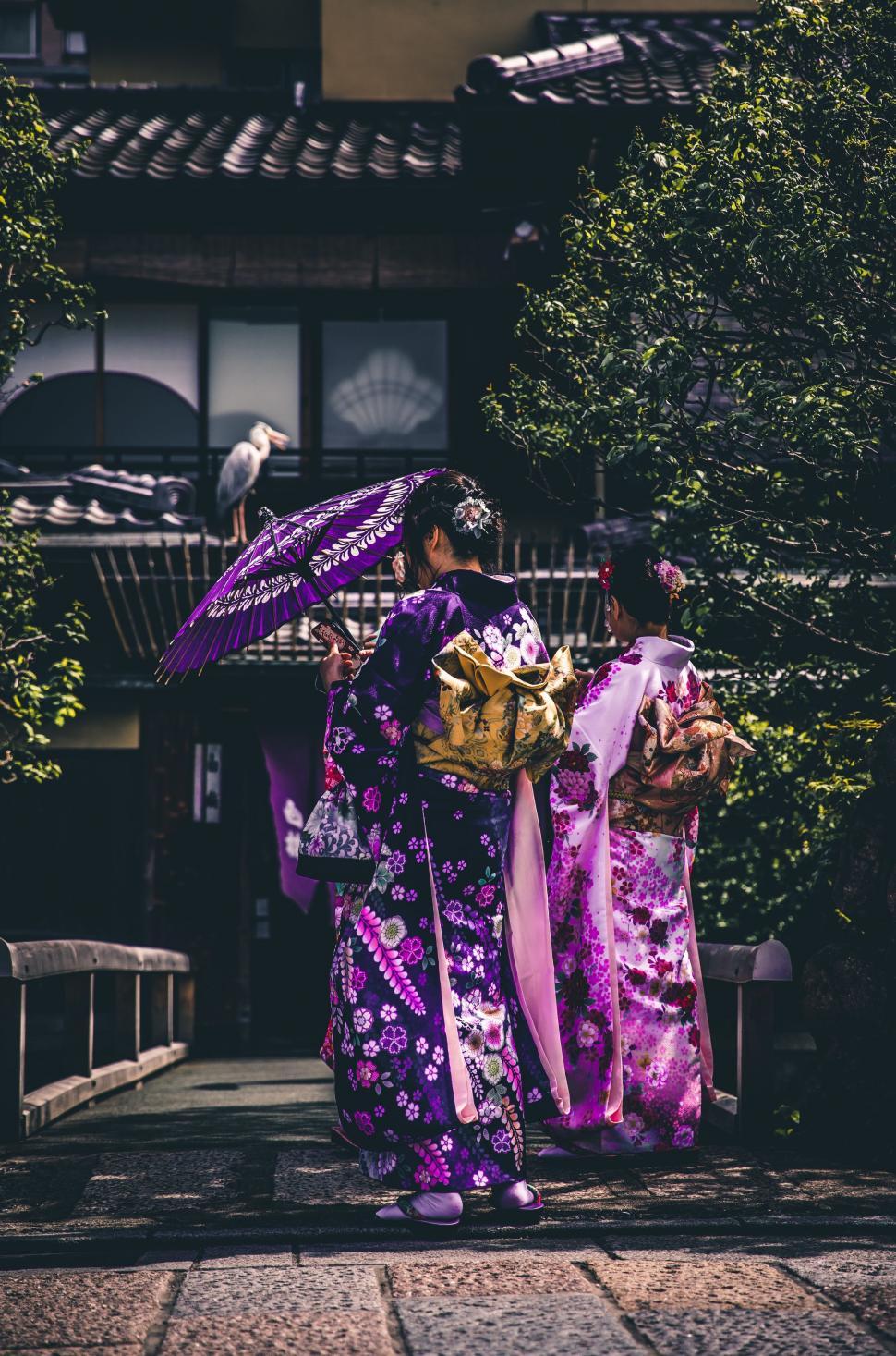 Free Image of Woman in Purple Kimono Holding Umbrella 