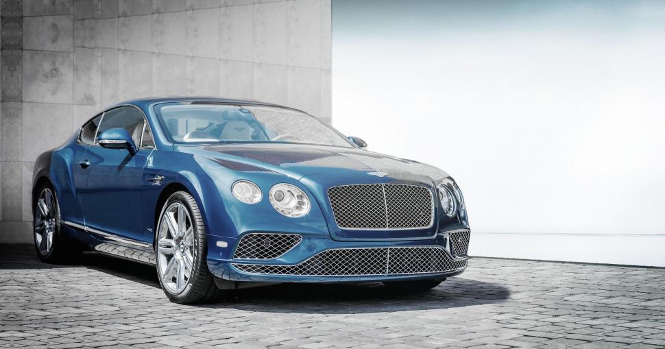 Free Image of Blue Bentley Parked in Front of Building 