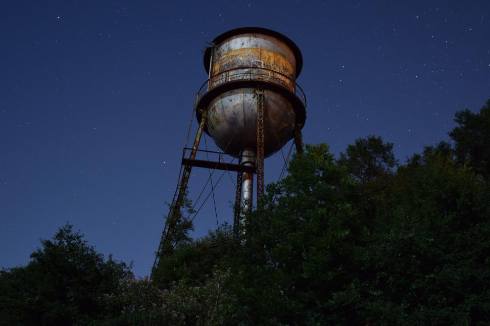 Free Image of Rusted Water Tower on Hilltop 