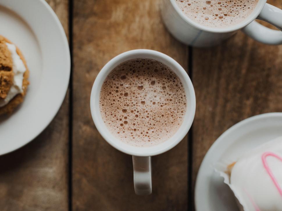 Free Image of Two Mugs of Hot Chocolate and a Plate of Cookies 