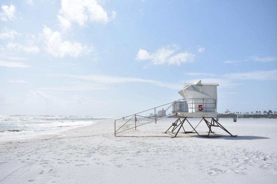 Free Image of Lifeguard Station on Beach by Ocean 
