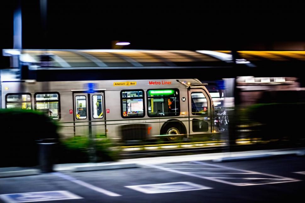Free Image of Public Transit Bus on City Street at Night 