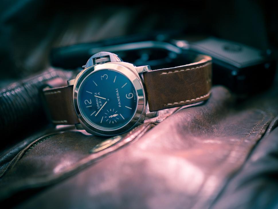 Free Image of Watch on Brown Leather Bag 