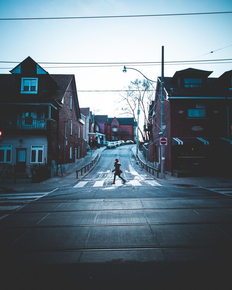 Free Image of Person Crossing Street in Urban Setting 