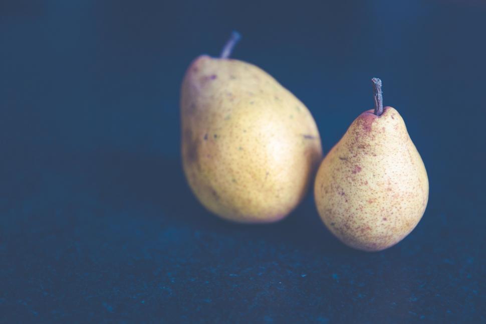 Free Image of Two Pears on Blue Surface 