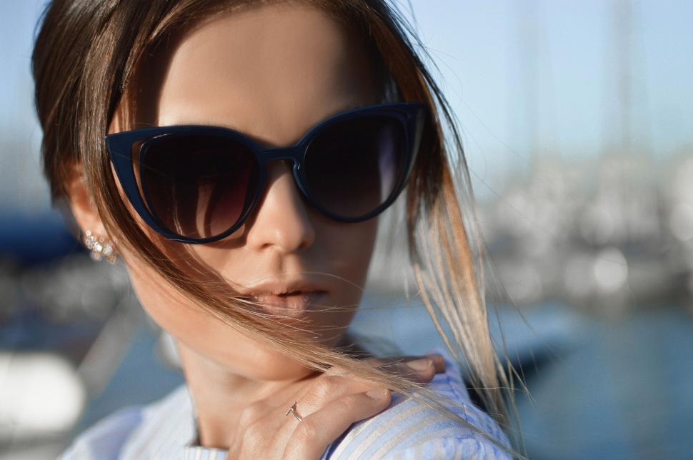 Free Image of Woman Wearing Sunglasses at Marina 