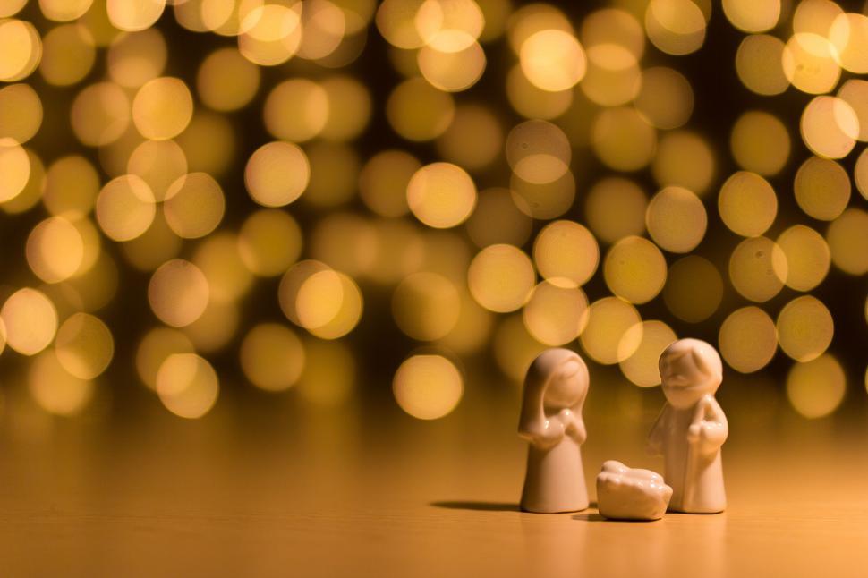 Free Image of Couple of Figurines Sitting on Table 