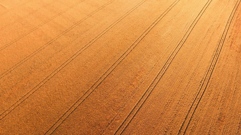Free Image of Tractor Driving Through Large Field 