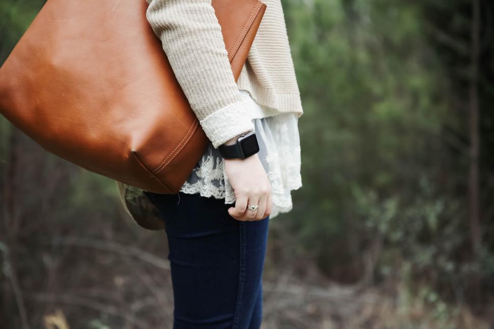 Free Image of Woman Carrying Brown Purse in Forest 