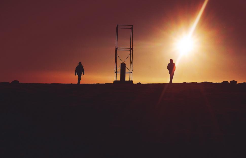 Free Image of Couple Standing on Top of Hill 