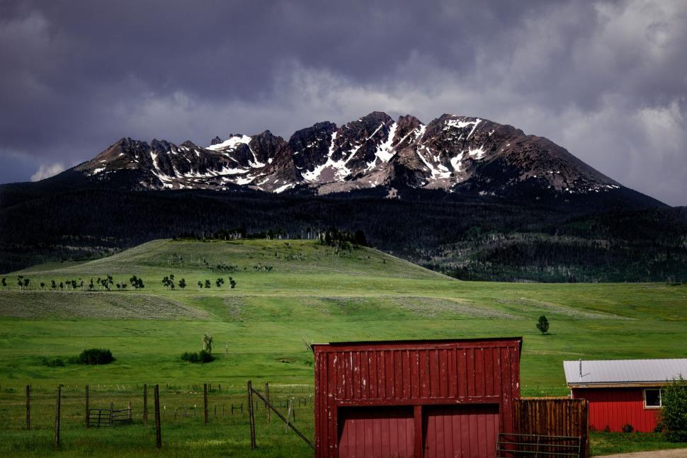 Free Image of Farm With Mountain in the Background 