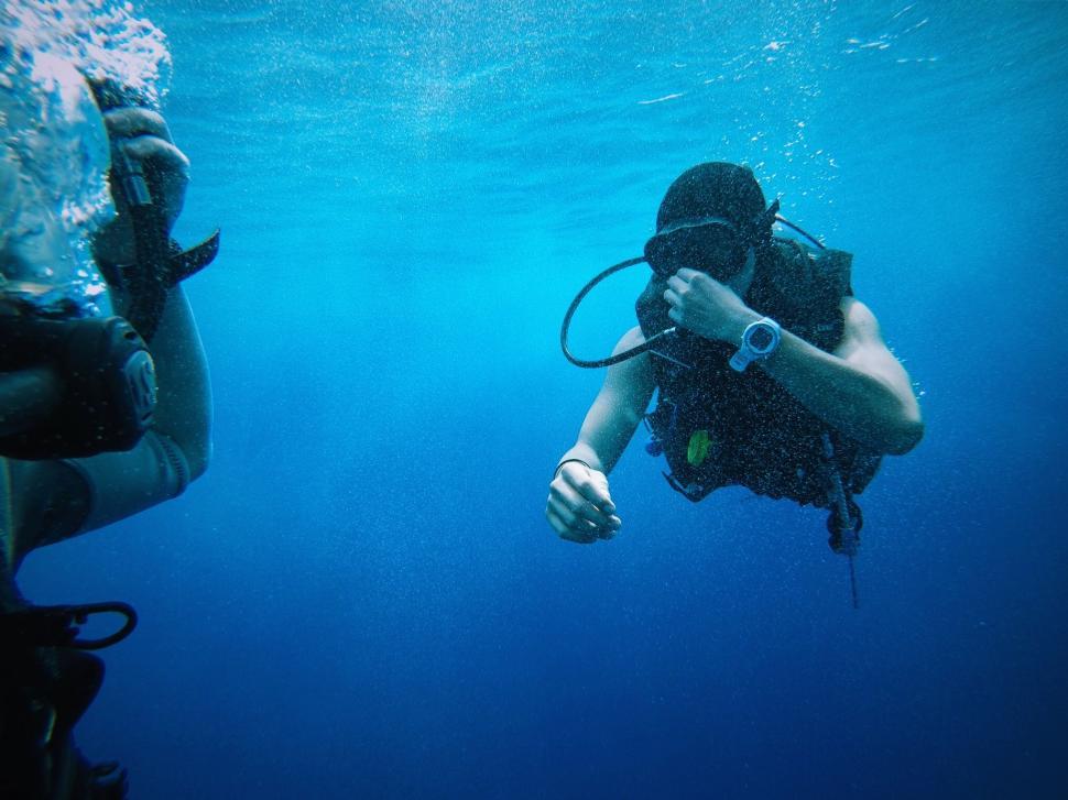 Free Image of Two Divers Exploring Underwater With Scuba Gear 