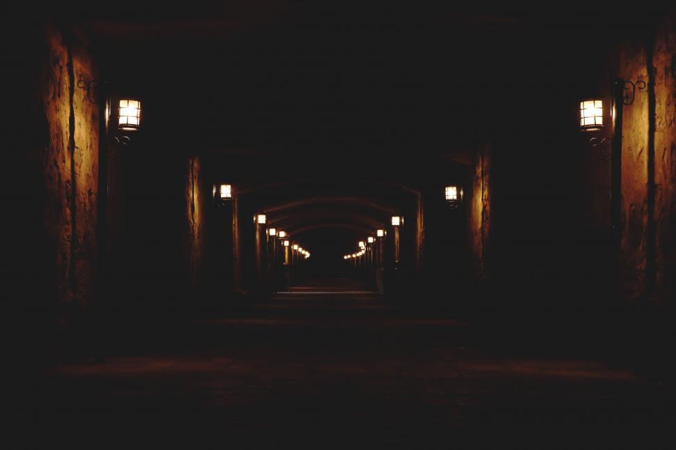 Free Image of Dark Tunnel With Lights on Either Side 