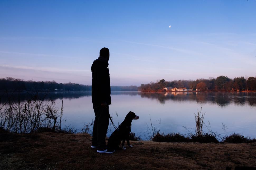Free Image of Man and Dog by Lake 
