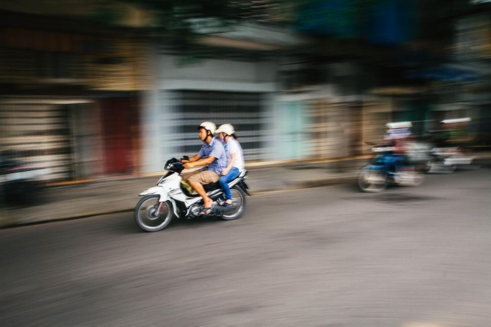 Free Image of Couple Riding on Motorcycle Together 