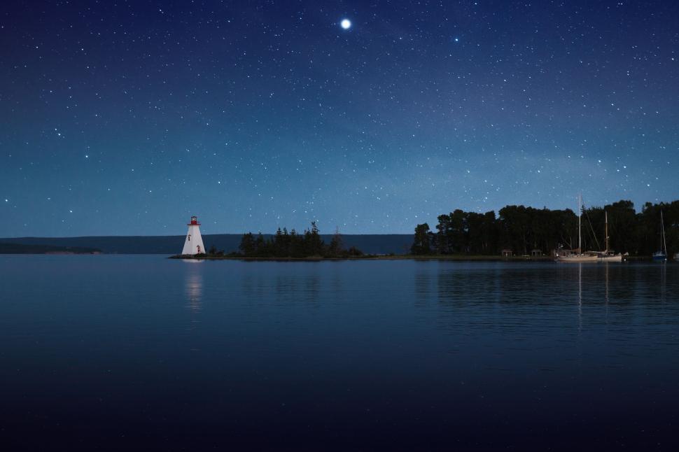 Free Image of Lighthouse Standing on Small Island in Lake 