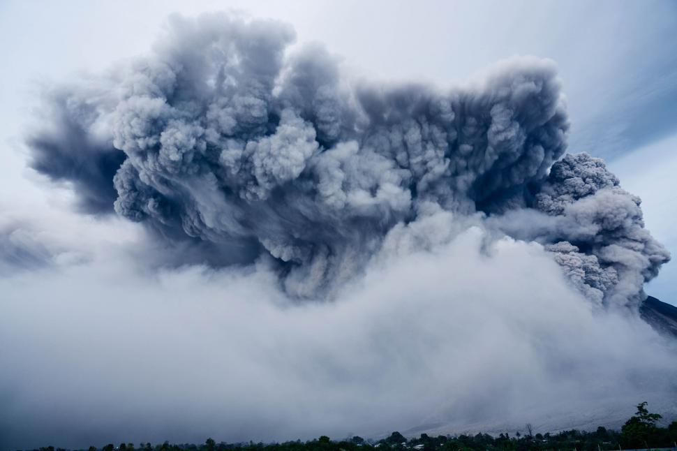 Free Image of Dramatic Plume of Smoke Emerging From Mountain 