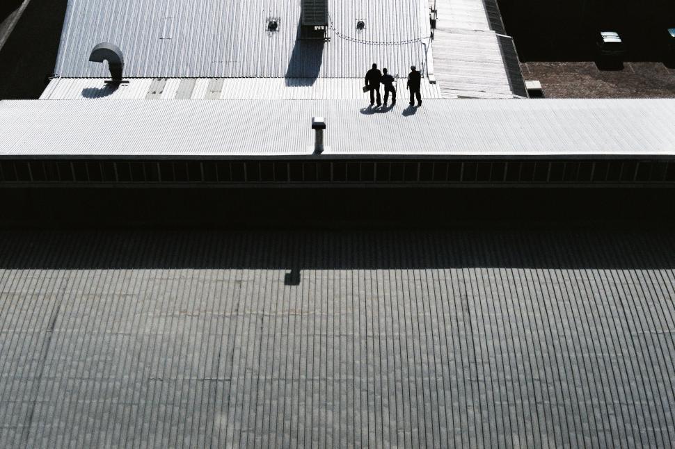 Free Image of Couple Standing on Rooftop 