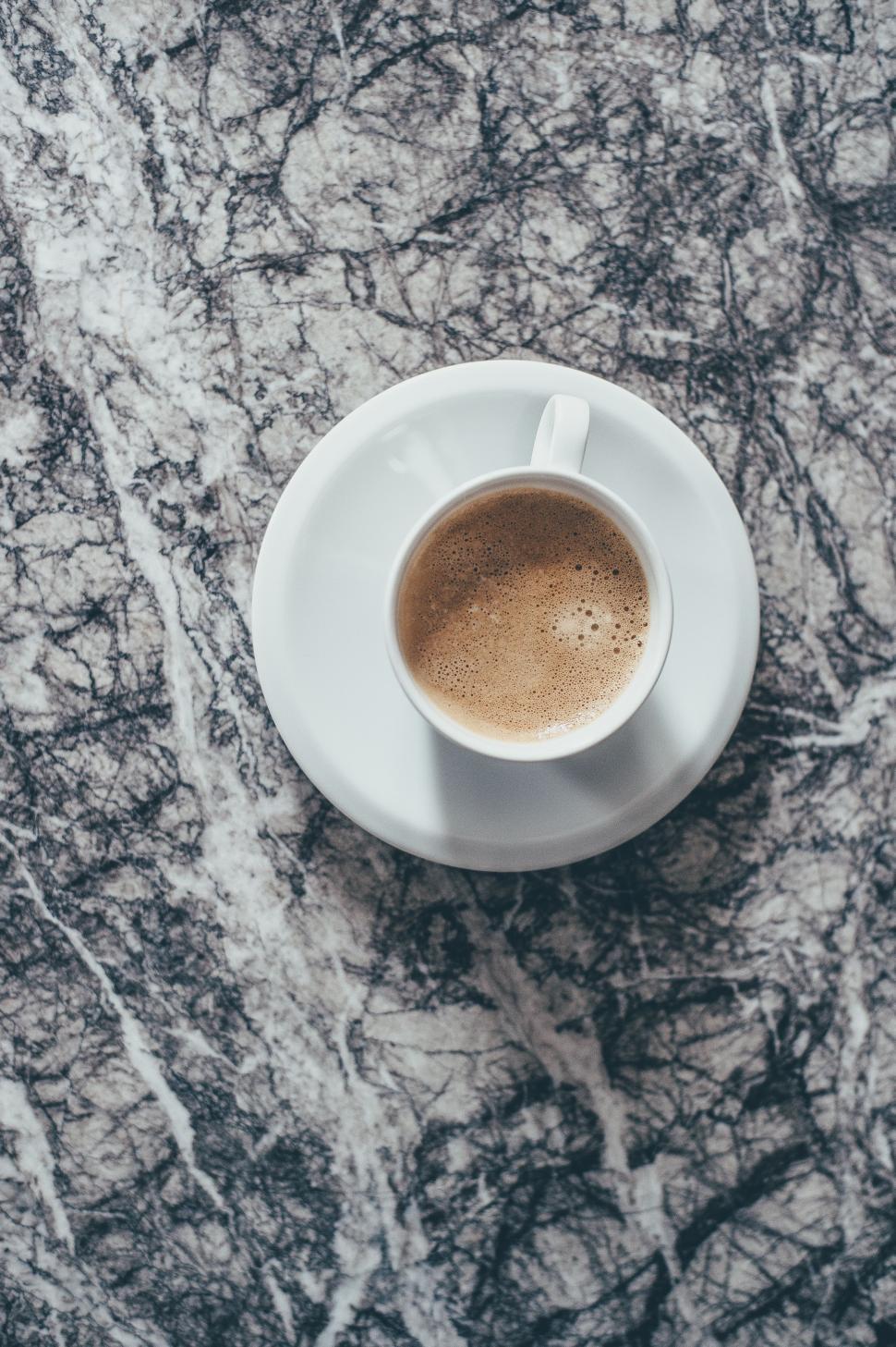Free Image of A Cup of Coffee on a White Saucer 