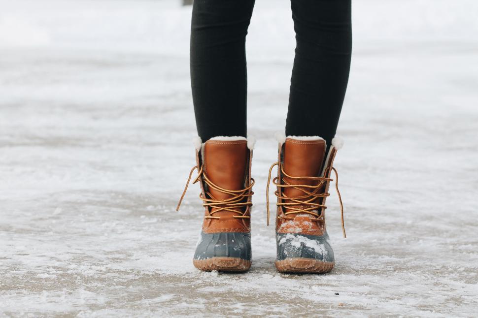Free Image of Person Standing in Snow With Boots 
