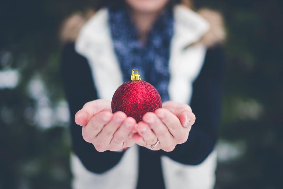 Free Image of Woman Holding Red Ornament 