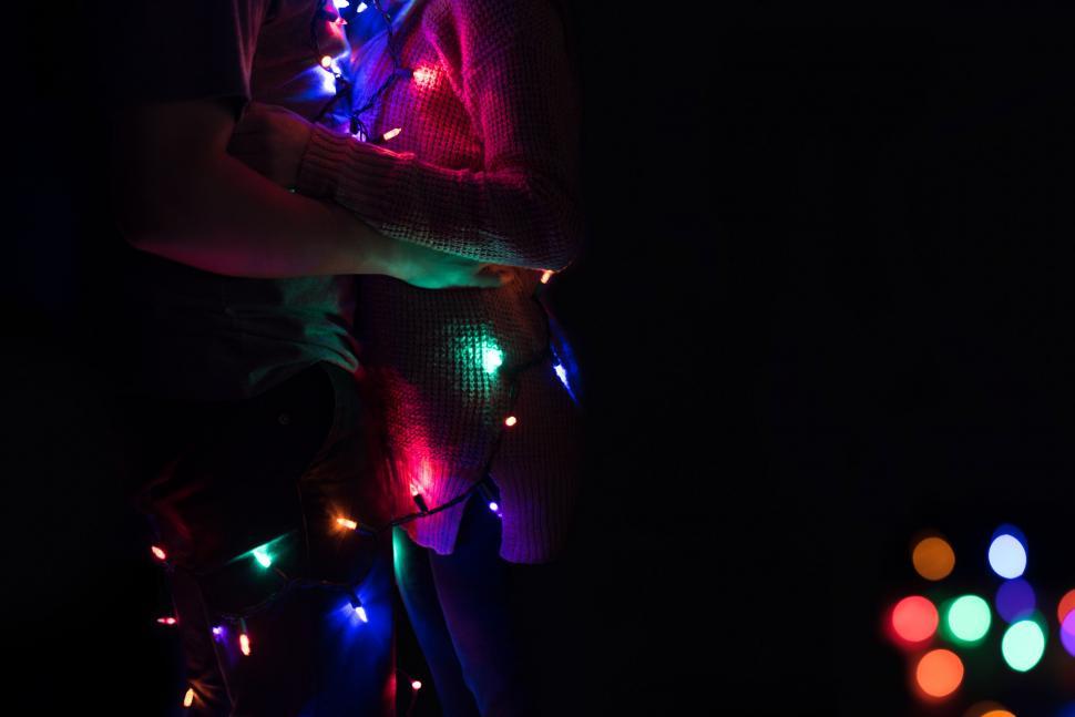 Free Image of Person Standing in Dark Room With Many Lights 